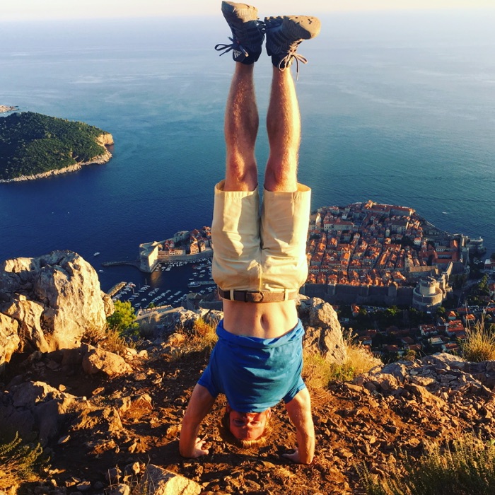 Headstand on a hilltop above the old town of Dubrovnik