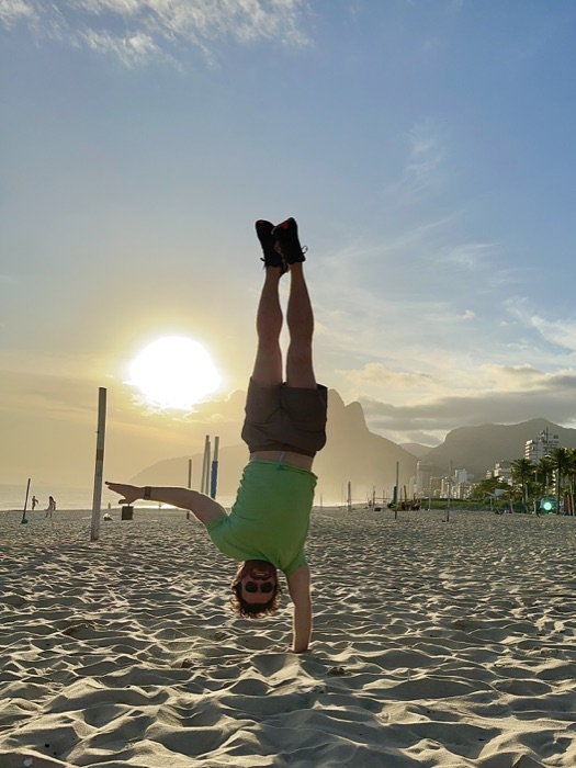 Handstand on the beach at sunset in Rio de Janeiro